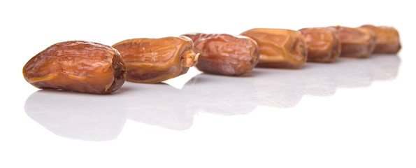 Date fruits over white background