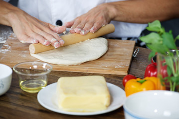 Cook prepare pizza dough