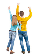 Back view of dancing young couple