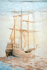 Graffiti wall by an unidentified artist with sea vessel