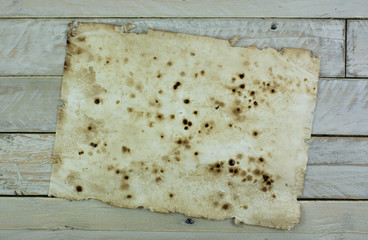 Old paper on wooden planks