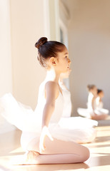 Obraz na płótnie Canvas Attentive Ballerina Girl at the Ballet Training