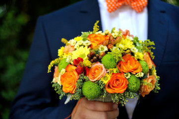 Wedding bouquet in men hands