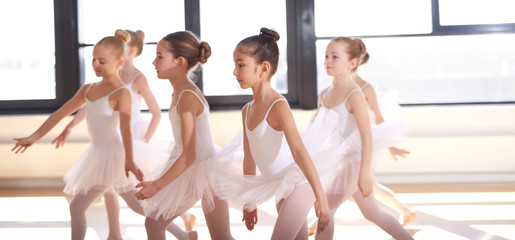 Group of young ballerinas performing