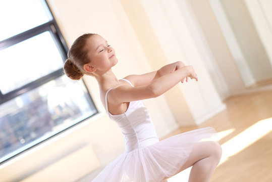 Pretty Ballet Girl Practicing Dance at the Studio
