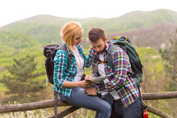 Hikers looking at map