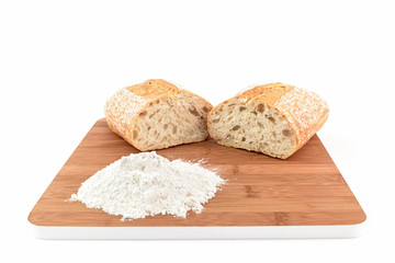 ciabatta bread on chopping board with flour
