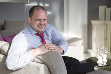 businessman sitting on couch