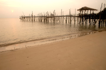 Fototapeta na wymiar Traditional wooden bridge on the beach.