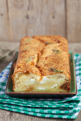 Savory loaf cake with parmesan cheese, feta cheese, figs