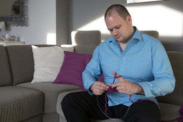 man is knitting