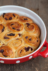 Traditional English buns Chelsea with dried cranberries 