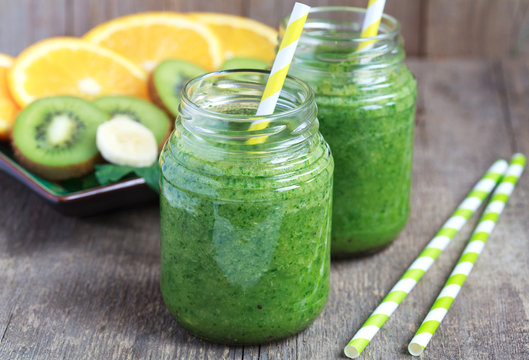Healthy green smoothie made from spinach, kiwi, bananas 