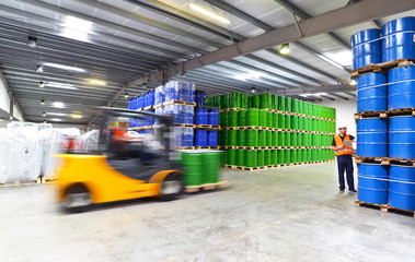 shipping - forklift and workers in a warehouse