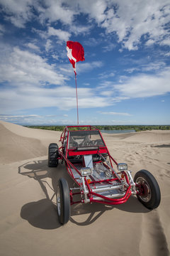 Red Dune Buggy In The Sand Dunes