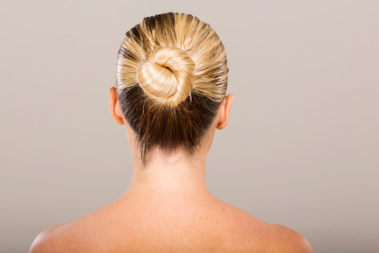 young woman with hair bun