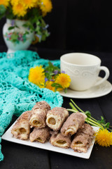 Fototapeta na wymiar Cookies rolls with rhubarb and cinnamon on a dark background