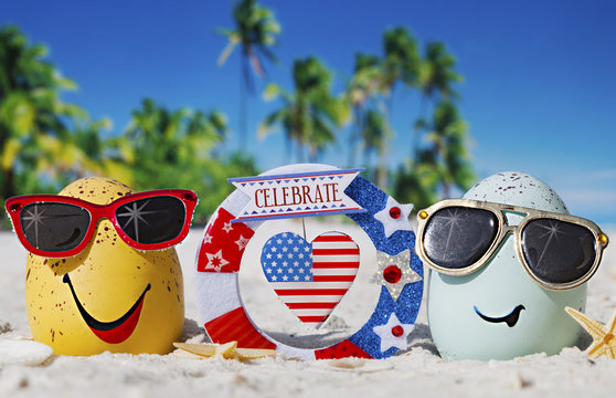 Happy eggs on ocean beach during patriotic holiday 
