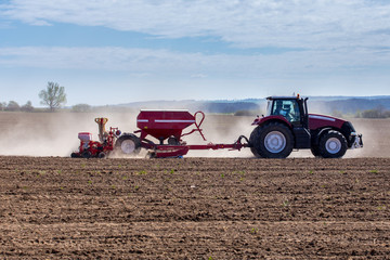 Tractor harrowing the field