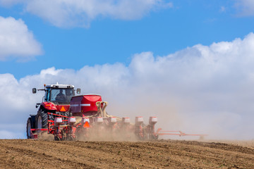 Tractor harrowing the field