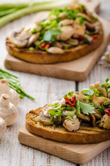Toast with mushrooms and fried chicken, sprinkled with