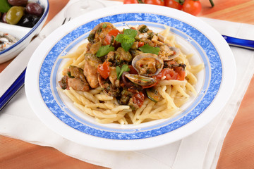 Trofie pasta with shellfish mollusks and fish 