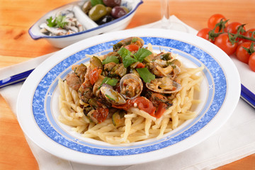 Trofie pasta with shellfish mollusks and fish 