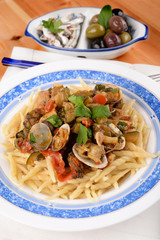 Trofie pasta with shellfish mollusks and fish 