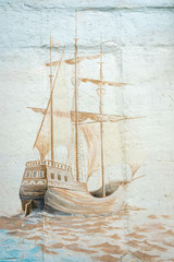 Graffiti wall by an unidentified artist with sea vessel