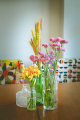 Flowers in a vase on a wooden table