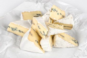 The cheese with a blue and a white mold