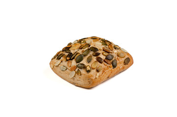 One roll bread with pumpkin seeds on white background