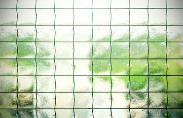 Abstract background made of glass with grating.