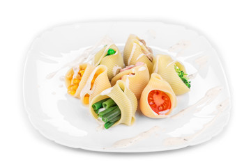 Pasta shells stuffed with vegetables and sausage