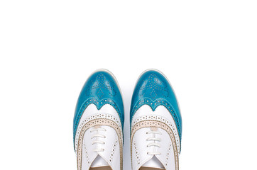 Beautiful blue woman shoes isolated on white background
