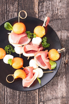 appetizer creative with melon,prosciutto and mozza