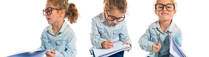Naklejka na ściany i meble Little girl with glasses learning