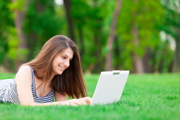 brunette student girl with laptop computer