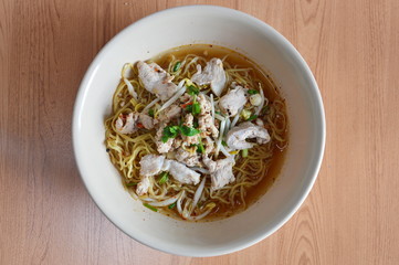 egg noodle topping with boiled pork in soup