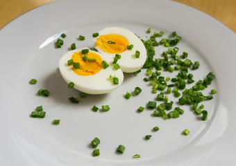 Boiled egg halves on a white plate