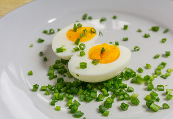 Boiled egg halves on a white plate