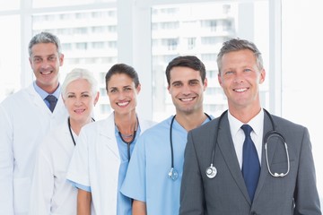 Fototapeta premium Portrait of confident doctors in row