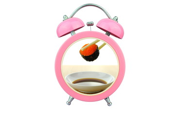 sushi within pink alarm clock isolated on white background