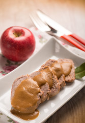 tenderloin with apple cream sauce, selective focus