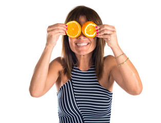 Woman wearing orange slices as glasses