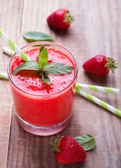 Strawberry smoothie on the wooden table