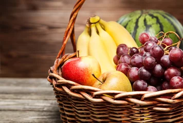  Basket full of fresh fruit © George Dolgikh