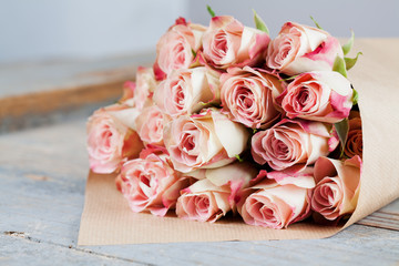 Bunch of beautiful roses packed in paper