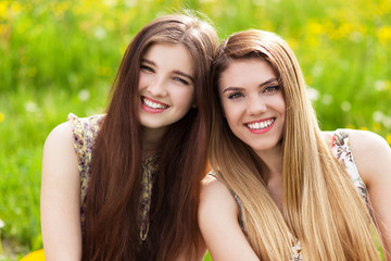 Two beautiful young women on a picnic