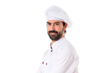 Chef with his arms crossed over white background
